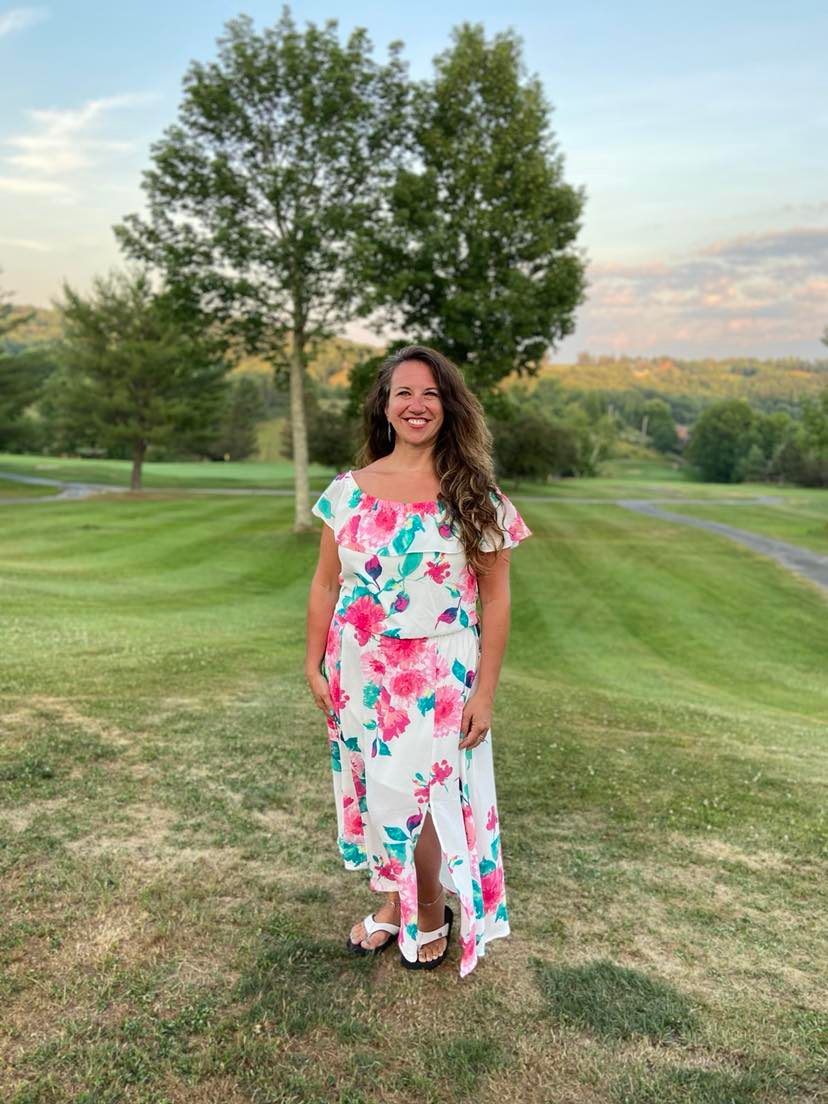 Natalie Lynch, founder of Empowering Creative Souls, smiling outdoors